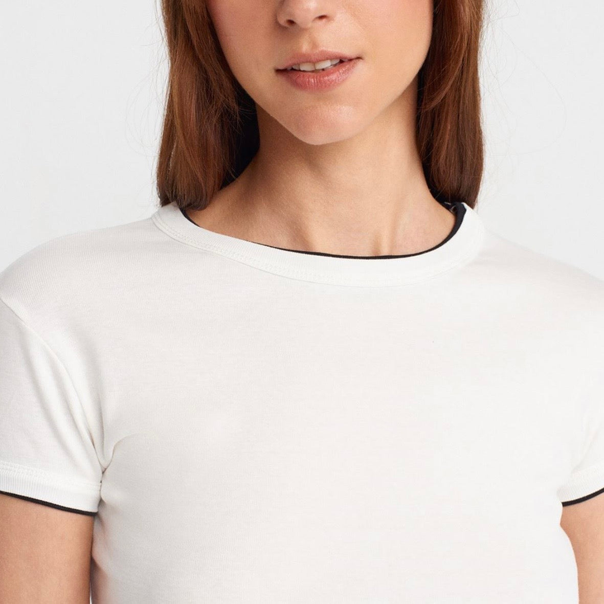 White fitted t-shirt with black trim